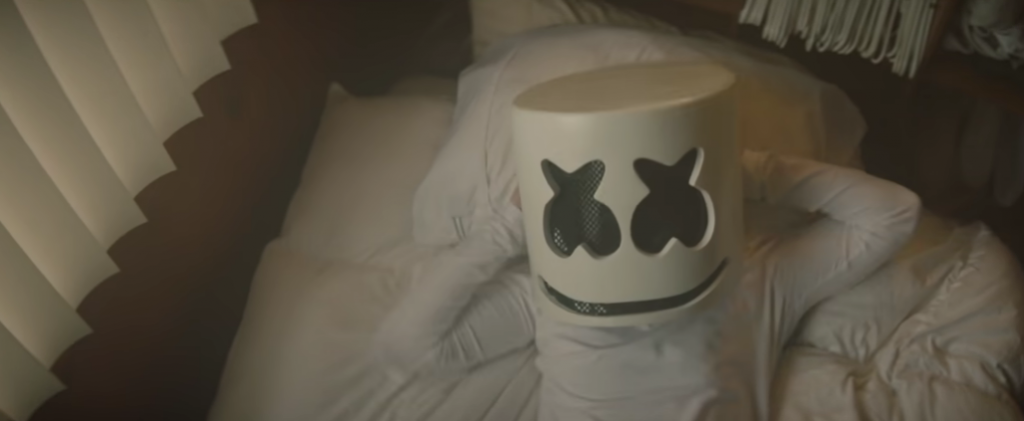 Dj Marshmello lying in bed in music video
